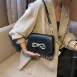 святкова сумка чорна шкіра з бантами