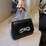 святкова сумка чорна шкіра з бантами