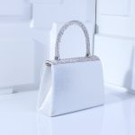 клатч з бантом та камінням