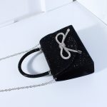 клатч з бантом та камінням