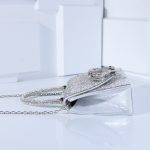 клатч з бантом та камінням